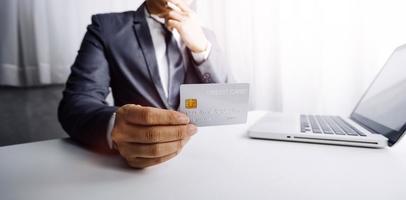 Woman hand using mobile smart phone, online payment, banking and online shopping at the home. photo