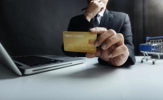 Woman hand using mobile smart phone, online payment, banking and online shopping at the home. photo