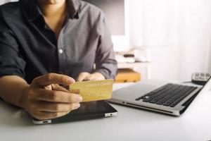 Woman hand using mobile smart phone, online payment, banking and online shopping at the home. photo