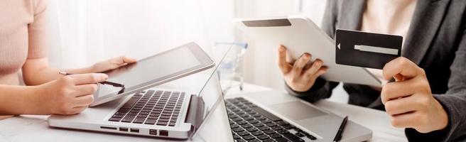 Woman hand using mobile smart phone, online payment, banking and online shopping at the home. photo