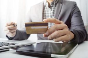 Woman hand using mobile smart phone, online payment, banking and online shopping at the home. photo