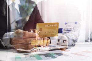 Woman hand using mobile smart phone, online payment, banking and online shopping at the home. photo