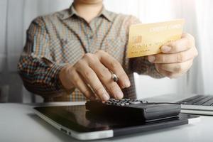 Woman hand using mobile smart phone, online payment, banking and online shopping at the home. photo