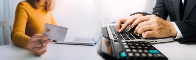 Woman hand using mobile smart phone, online payment, banking and online shopping at the home. photo