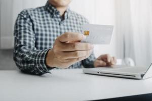 Woman hand using mobile smart phone, online payment, banking and online shopping at the home. photo