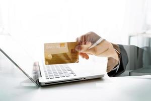 Woman hand using mobile smart phone, online payment, banking and online shopping at the home. photo