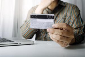 Woman hand using mobile smart phone, online payment, banking and online shopping at the home. photo