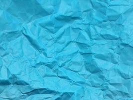 Modern blue crumpled paper texture background for Design. photo