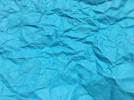 Modern blue crumpled paper texture background for Design. photo