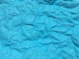 Modern blue crumpled paper texture background for Design. photo