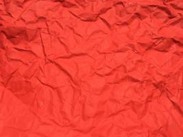Red crumpled paper texture background for Design. Wallpaper  for copy space photo