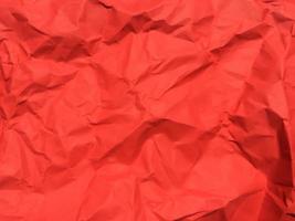 Red crumpled paper texture background for Design. Wallpaper  for copy space photo