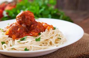 Pasta and meatballs with tomato sauce photo