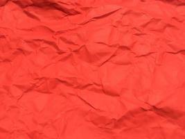 Red crumpled paper texture background for Design. Wallpaper  for copy space photo