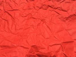 Red crumpled paper texture background for Design. Wallpaper  for copy space photo