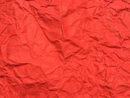 Red crumpled paper texture background for Design. Wallpaper  for copy space photo