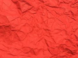 Red crumpled paper texture background for Design. Wallpaper  for copy space photo