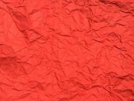 Red crumpled paper texture background for Design. Wallpaper  for copy space photo