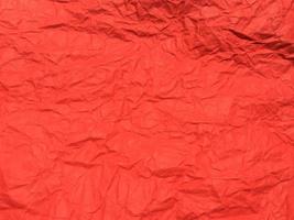 Red crumpled paper texture background for Design. Wallpaper  for copy space photo