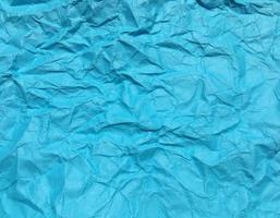 Modern blue crumpled paper texture background for Design. photo