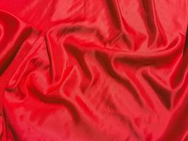 Red fabric texture for backgroundwith coy space. Valentines Day or Christmas Day wallpaper design photo