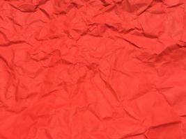 Red crumpled paper texture background for Design. Wallpaper  for copy space photo