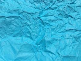 Modern blue crumpled paper texture background for Design. photo