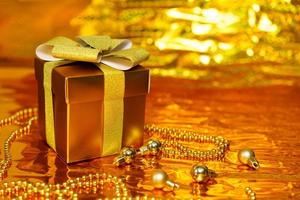 golden gift box on shiny background photo