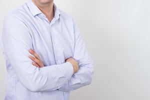Business man without a face in a shirt on a light background photo