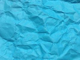 Modern blue crumpled paper texture background for Design. photo