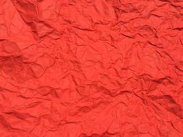 Red crumpled paper texture background for Design. Wallpaper  for copy space photo