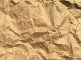 Brown wrinkle recycle paper background for Design. Blank  surface for text or work photo