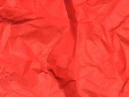 Red crumpled paper texture background for Design. Wallpaper  for copy space photo