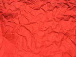 Red crumpled paper texture background for Design. Wallpaper  for copy space photo