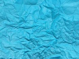 Modern blue crumpled paper texture background for Design. photo