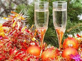 Two glasses with gold Xmas decorations and tree 4 photo