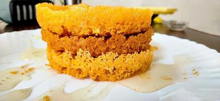 Popular and traditional Indian Rajasthani sweet dessert called Ghevar or Ghewar photo