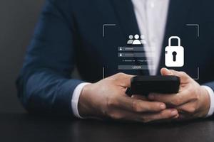 Cybersecurity and privacy concepts to protect data. Lock icon and internet network security technology. Businessmen protecting personal data on smartphone and virtual interfaces. photo