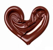 Chocolate splashes in heart shape. photo