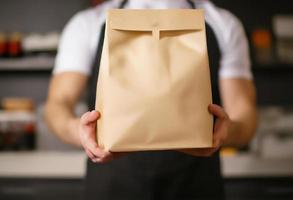 Various paper containers for take away food. delivery man carrying. photo