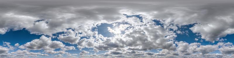 Seamless overcast blue sky hdri panorama 360 degrees angle view with zenith and beautiful clouds for use in 3d graphics as sky replacement and sky dome or edit drone shot photo