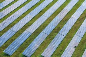 aerial view on farm field of solar panels. Renewable solar energy. photo