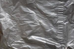 Gray plastic bag texture background close up photo