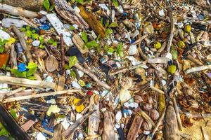 Garbage Dirt Plastic Poison Litter and Pollution on Beach Thailand. photo