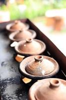 Indonesian Earthen Ware on the Stove for Making Traditional Food Pancake like Srabi Solo, Apem,  or Surabi Bandung photo