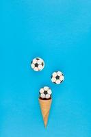 Football macaroons in waffle cones photo