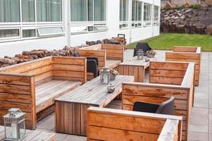 Outdoor restaurant terrace with wooden furniture photo