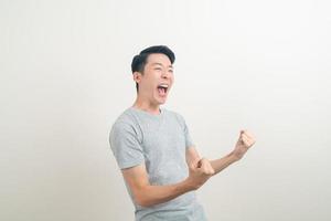 young Asian man with successful action photo