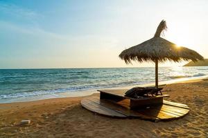 beach chair and umbrella with sea beach background photo