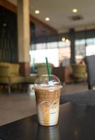 caramel macchiato coffee cup in coffee shop photo